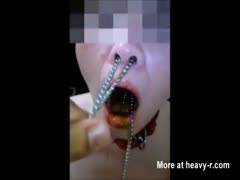 Whore chaining her mouth and nose while getting pissed on